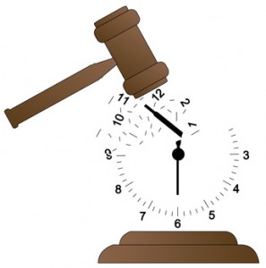 gavel smashing clock and scattering it - time concept
